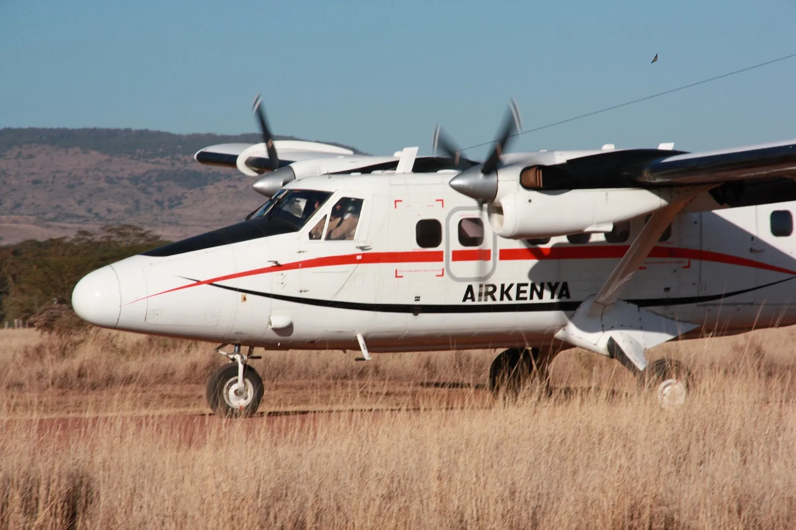 A light aircraft used for safari transfers on an East African airstrip